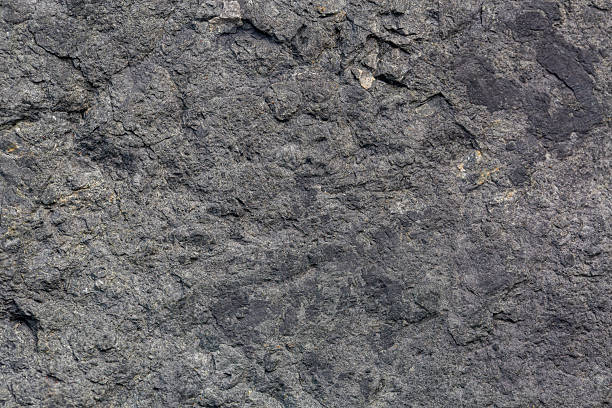 istock Macro stone detail texture,Black slate stone texture background,Dark rough natural rock texture background 2224120156
