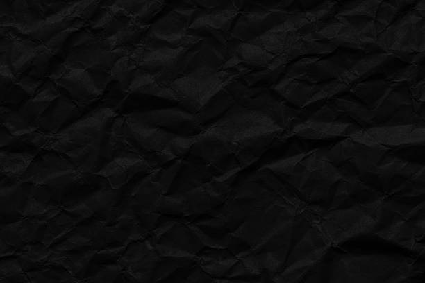 istock Close-up macro of black crumpled paper texture,black crumpled paper texture pattern,Background of black crumpled paper close up macro,black crumpled paper texture pattern 2224120208