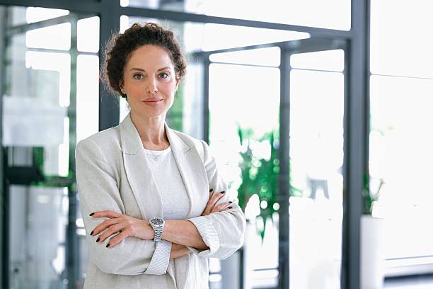 istock Confident businesswoman posing in modern office environment 2224120828