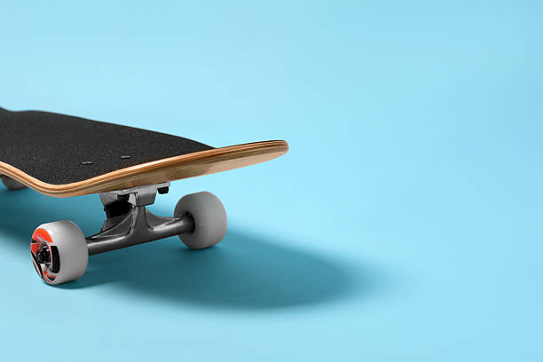 istock One skateboard on light blue background, closeup. Space for text 2224120952