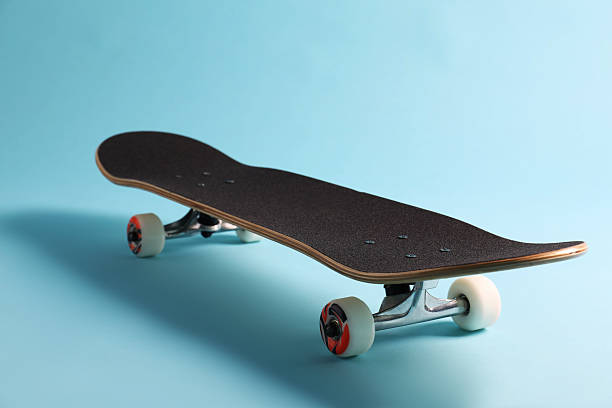 istock One skateboard on light blue background, closeup. Sports equipment 2224120975