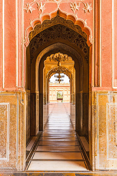 istock This captivating view inside Badshahi Mosque highlights the exquisite details of its historical design, with golden hues and elegant patterns drawing the eye through its magnificent halls. 2224121012