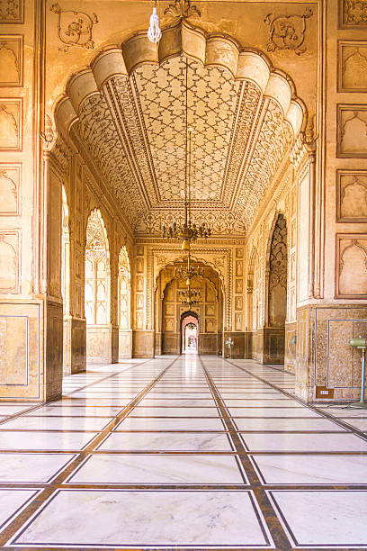 istock This captivating view inside Badshahi Mosque highlights the exquisite details of its historical design, with golden hues and elegant patterns drawing the eye through its magnificent halls. 2224121021