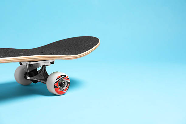 istock One skateboard on light blue background, closeup. Space for text 2224121047