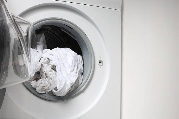 istock Open washing machine with clean clothes, closeup. Space for text 2224122819