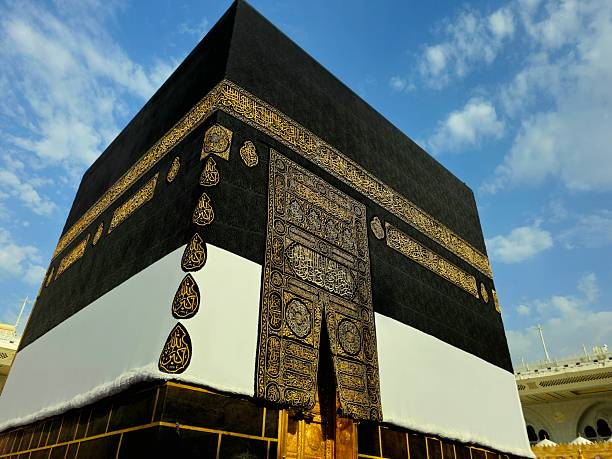 The Kaaba in Ihram Kiswa in the grand mosque in Makkah, the direction of praying Qibla, Tawaf done around it by pilgrims in Hajj Umrah