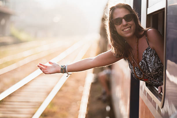 istock Tourist saying goodbye from train window during sunset 2224126192