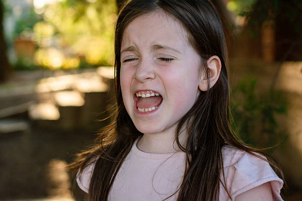 istock Sad young girl crying in nature 2224127507