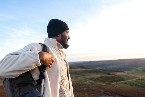 istock Hiker enjoying the sunset view from a high vantage point on a mountain in an expansive landscape 2224128016