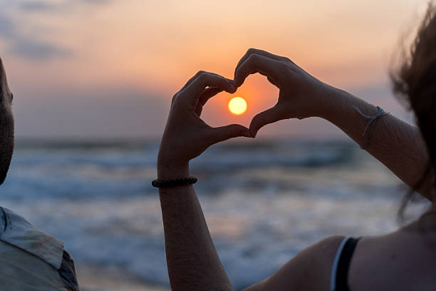 istock Romantic sunrise meditation on a tranquil beach 2224131484