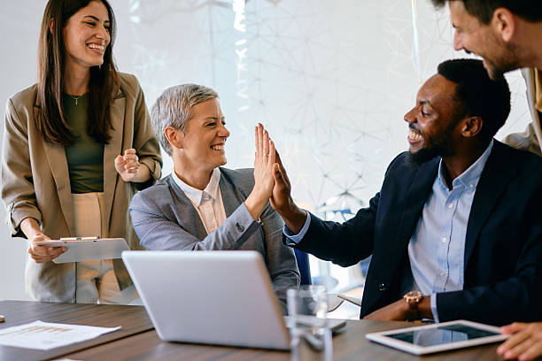 istock Diverse Team Celebrating Success in Modern Office 2224132571