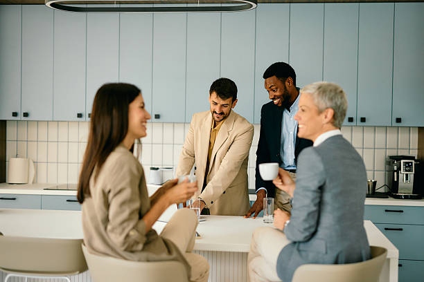 istock Professionals Engaging in Office Discussion Over Coffee 2224132734