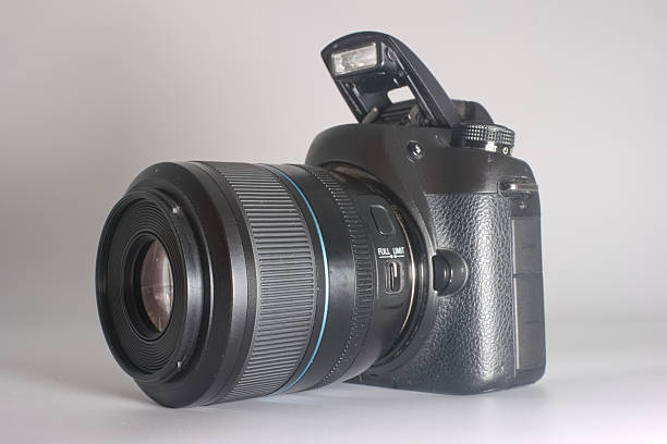 This DSLR camera displays its advanced design with a prominent lens and flash unit, ideal for capturing stunning visuals in various settings.