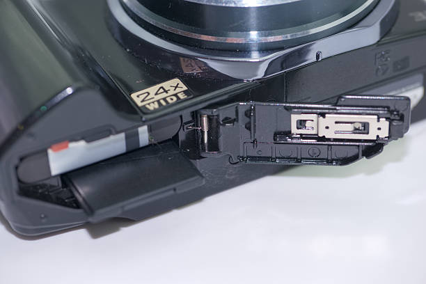 istock Camera showcasing a 24x wide zoom lens with an open compartment for battery and memory card access 2224133009
