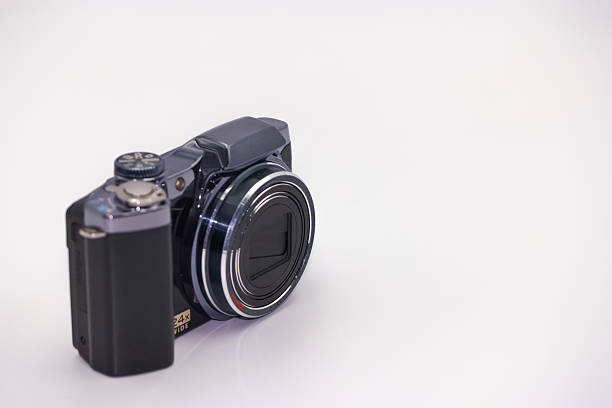 istock Compact digital camera positioned on a white surface showcasing modern design with clear lens and creative potential 2224133016