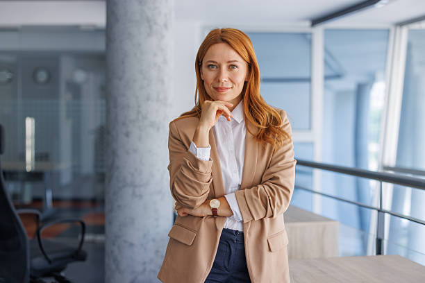 istock Confident businesswoman standing in modern office 2224133880