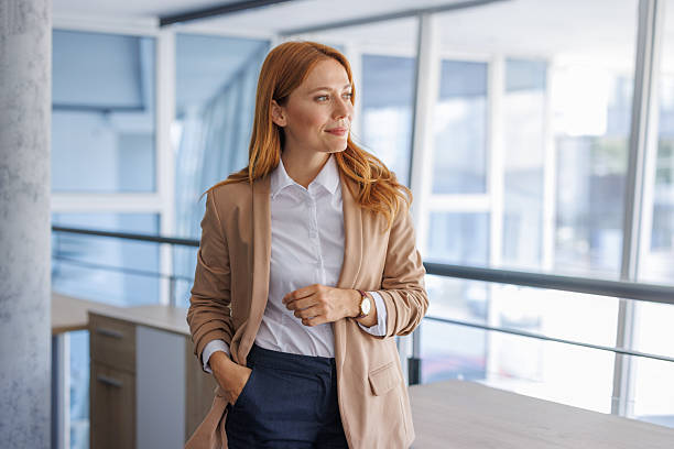 istock Confident businesswoman standing in modern office 2224133883