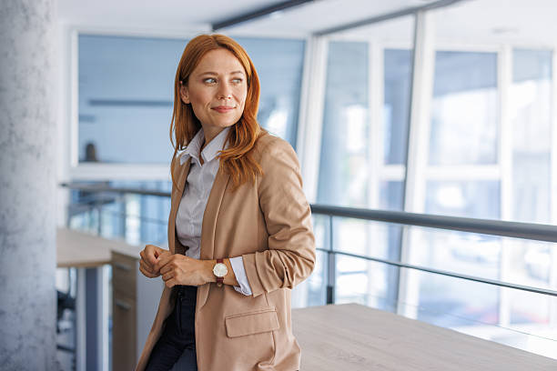 istock Confident businesswoman standing in modern office 2224133894