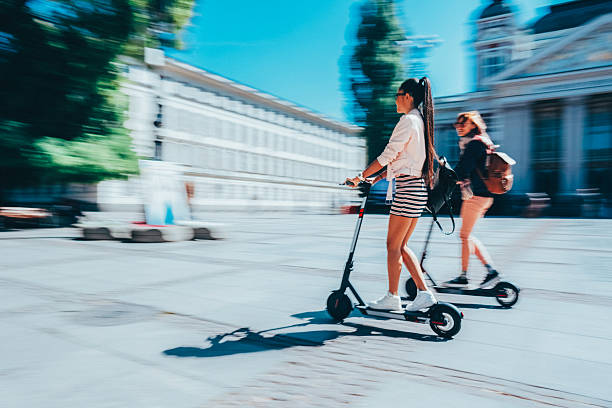 istock Tourists exploring the city on motor scooters 2224135249