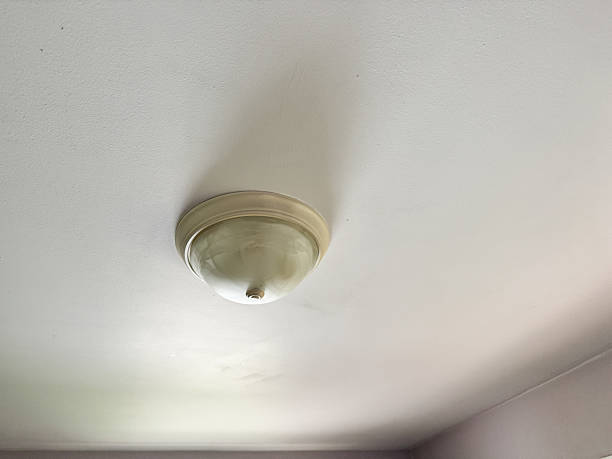 istock Round light fixture, builder grade, found in many American homes 2224144327