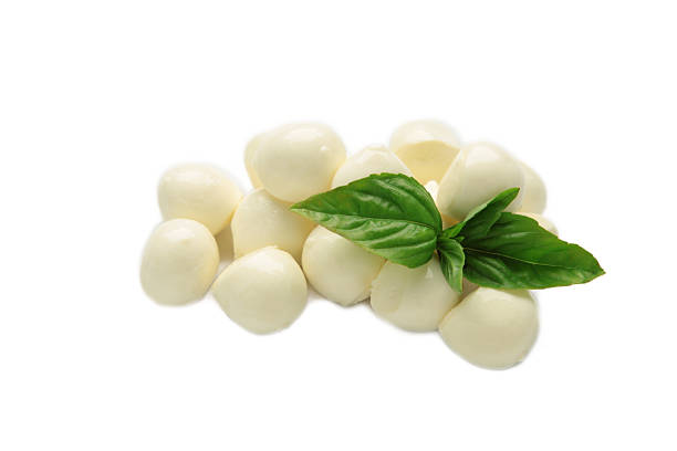 istock Mini mozzarella with green basil isolated on white background. 2224145972