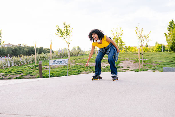 istock Young woman roller skating in a public park 2224147241
