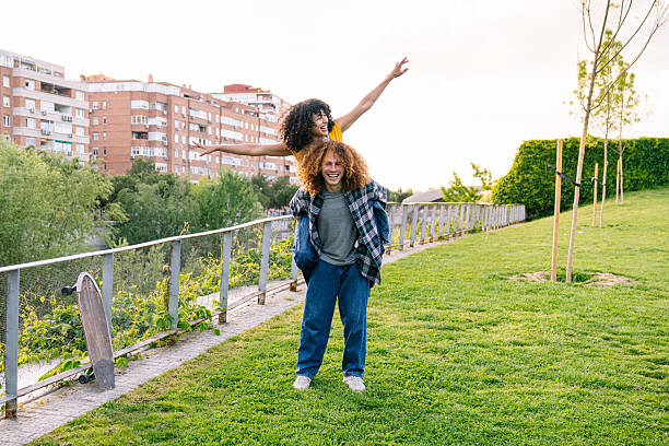 istock Joyful friends enjoying skateboarding in park 2224148246