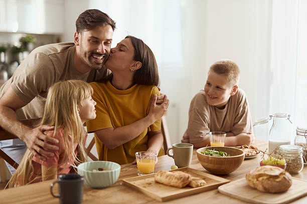 istock Young happy family enjoying in their breakfast at dining table 2224149093
