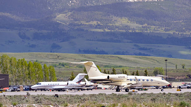 Jackson Hole, Wyoming, USA - 27 May 2025: Scenic view of Gulfstream G450 private executive jet (registration N251HR) and other corporate jets at Jackson Hole airport.