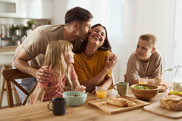 istock Young happy family enjoying in their breakfast at dining table 2224153973