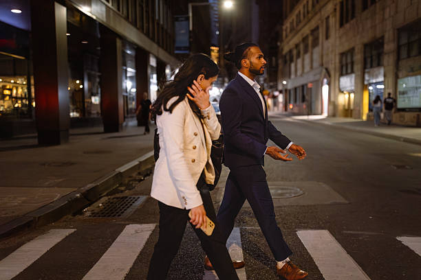istock Evening City Walk: Business Professionals Crossing Street 2224156705