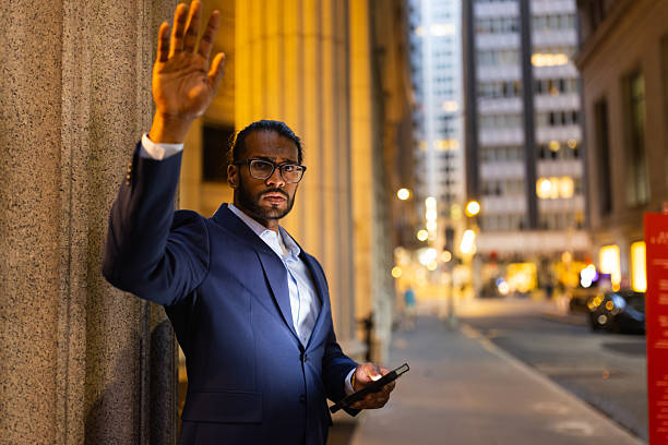 istock Businessman Hailing a Cab in City 2224156738