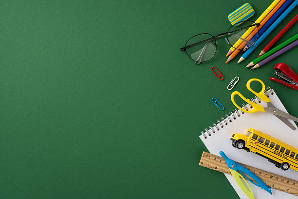 istock Various vibrant school supplies scattered on a green background, emphasizing creativity and education 2224158464