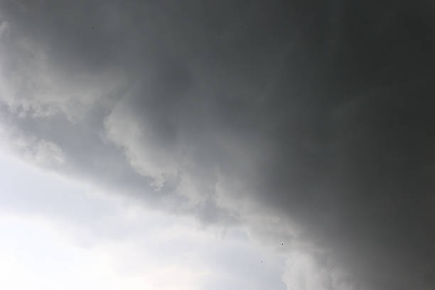Dark storm clouds forming in the sky before a thunderstorm. Dramatic, moody atmosphere symbolizing danger, natures power, or emotional tension. High quality photo