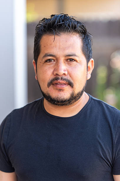 istock Headshot of a smiling mature Hispanic man posing looking at camera 2224158522
