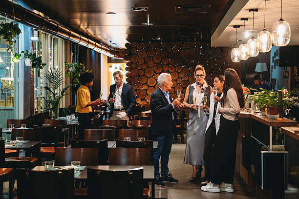 istock Colleagues enjoying drinks together after work at a restaurant 2224164196