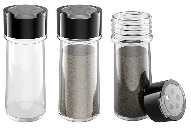 Glass spice jars with black lids. one empty, two filled with ground black pepper, one with open lid. 3D rendering isolated on white background