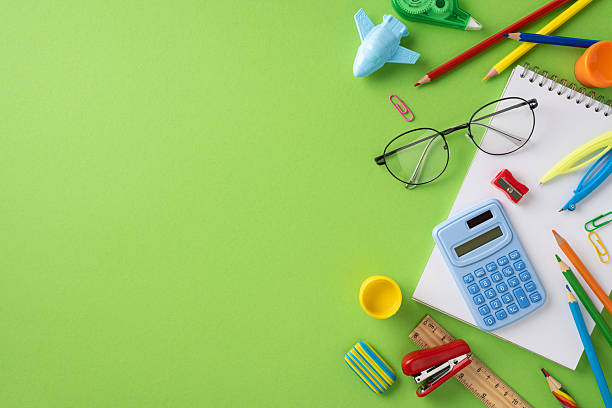 istock Educational supplies including stationery and a notebook on a green background for studying and creativity 2224165574
