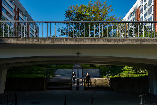 Stockholm, Sweden May 16, 2025 Twopeople walk down a public staircase in the Solna district.