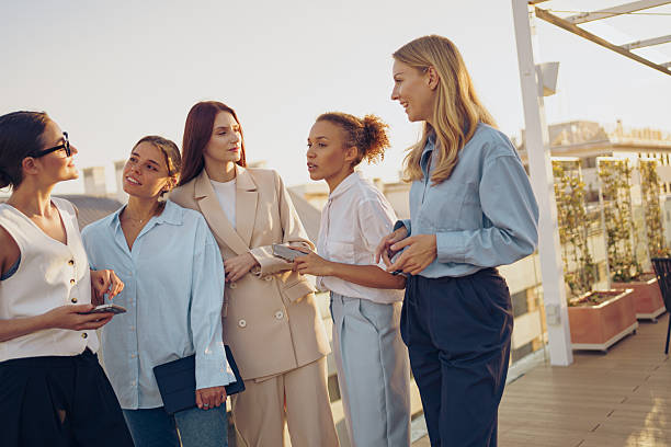 istock Modern Businesswomen Engaging in Networking Activities on a Rooftop Gathering Space 2224169803