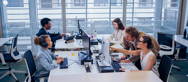 istock A bustling office filled with professionals collaborating and innovating together 2224169854