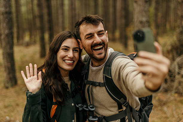 istock Hikers taking a selfie and waving in the forest 2224175072