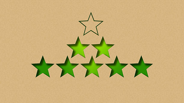 A conceptual illustration of progress and achievement, showing a pyramid of green stars created with a paper-cut effect. This graphic symbolizes reaching new levels of success, setting goals, and continuous improvement, all within a sustainable or eco-friendly framework. It is perfect for representing business growth, performance metrics, and the journey toward excellence.