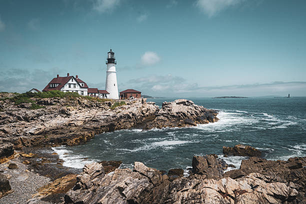 istock Classic Lighthouse on Rocky Cliffs Overlooking the Atlantic Ocean 2224177901