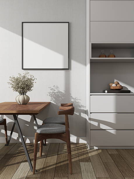 Modern dining room with a square frame mockup on a white wall next to a decorative sideboard