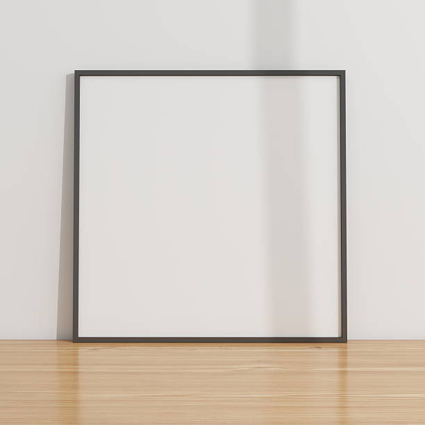 istock Square frame mockup on a wooden table and white wall 2224178347