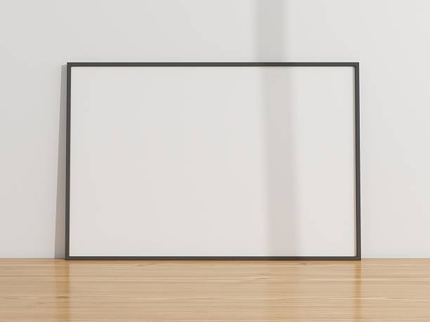 istock Horizontal frame mockup on a wooden table and white wall 2224178348