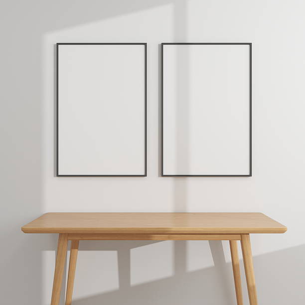 istock Two vertical frame mockups on a wooden table and white wall 2224178370