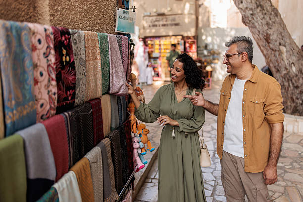 istock Arab Woman Choosing Headscarf with Husband’s Help 2224179309