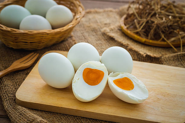 istock Salted duck eggs on wooden board 2224180406